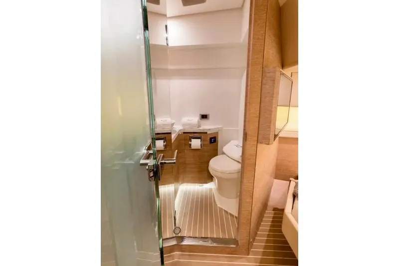 You Only Live Twice Yacht Photos Pics Luxurious bathroom interior of 2020 Scout 530 LXF yacht with modern amenities.