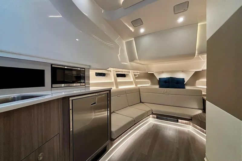  Yacht Photos Pics Luxurious interior of 2022 Sea Ray Sundancer 370 Outboard with modern seating and kitchen amenities.