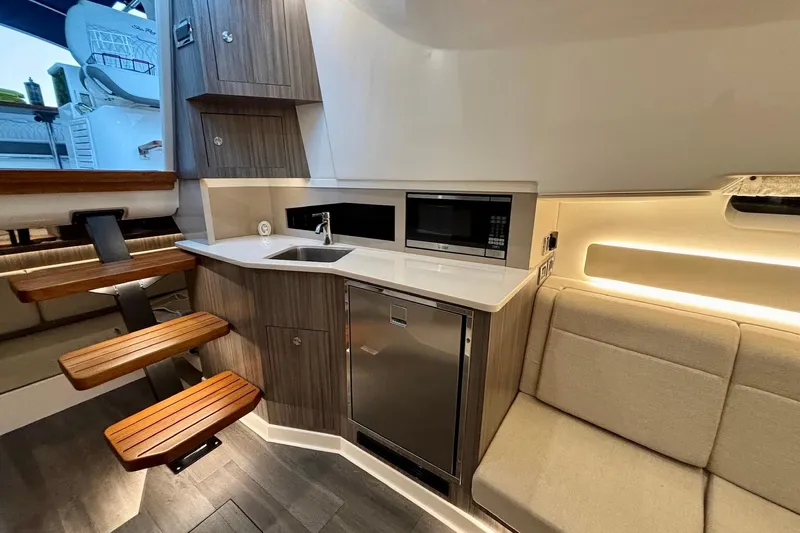  Yacht Photos Pics 2022 Sea Ray Sundancer 370 Outboard interior with kitchenette, seating, and modern amenities.