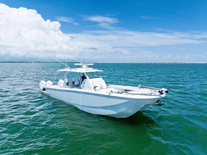Down Range Yacht Photos Pics 2023 Barker Boatworks 40 HPC cruising on clear blue ocean waters.