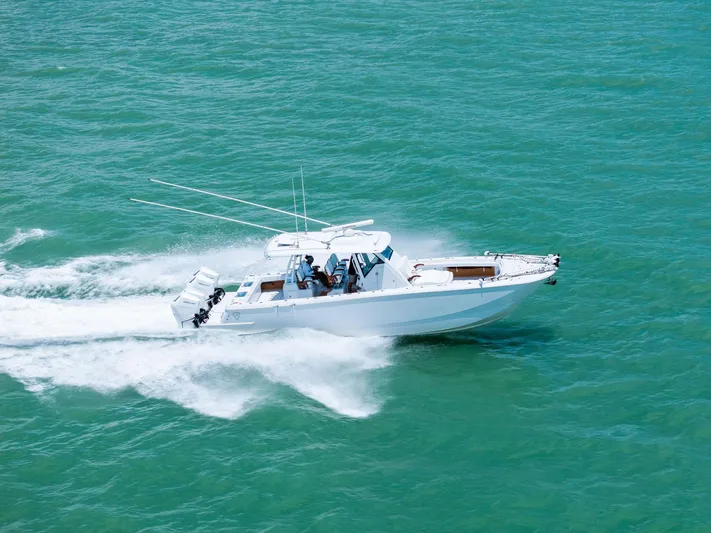 Down Range Yacht Photos Pics 2023 Barker Boatworks 40 HPC speeding on turquoise water.