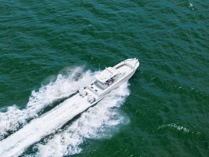 Down Range Yacht Photos Pics 2023 Barker Boatworks 40 HPC cruising on open water, aerial view.