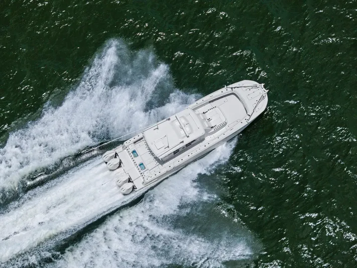 Down Range Yacht Photos Pics Aerial view of 2023 Barker Boatworks 40 HPC speeding on open water.