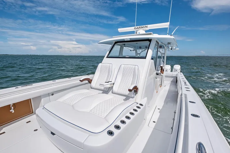 Down Range Yacht Photos Pics 2023 Barker Boatworks 40 HPC on open water, featuring luxurious seating and advanced navigation.