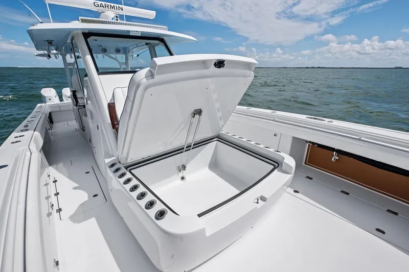 Down Range Yacht Photos Pics 2023 Barker Boatworks 40 HPC with open storage compartment on calm ocean.