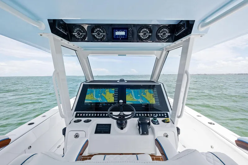 Down Range Yacht Photos Pics 2023 Barker Boatworks 40 HPC helm with dual navigation screens on open water.