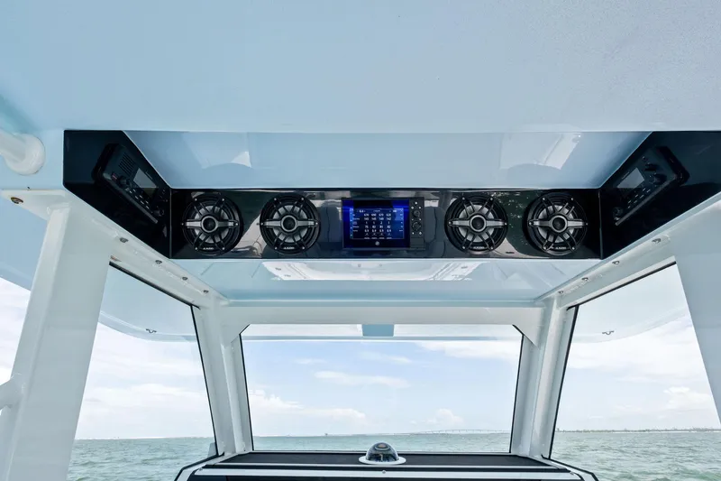 Down Range Yacht Photos Pics 2023 Barker Boatworks 40 HPC helm with advanced audio system and ocean view.