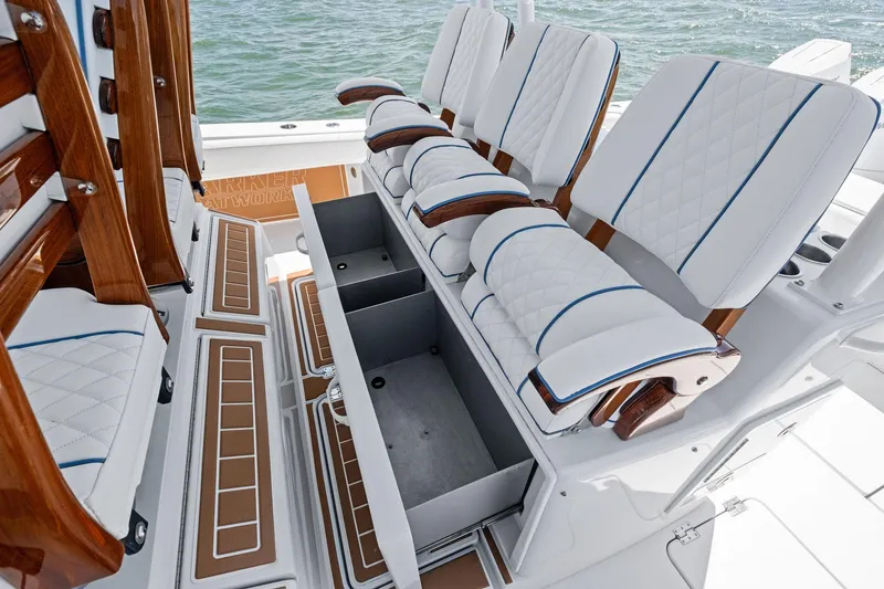 Down Range Yacht Photos Pics 2023 Barker Boatworks 40 HPC interior with luxurious seating and storage compartments.
