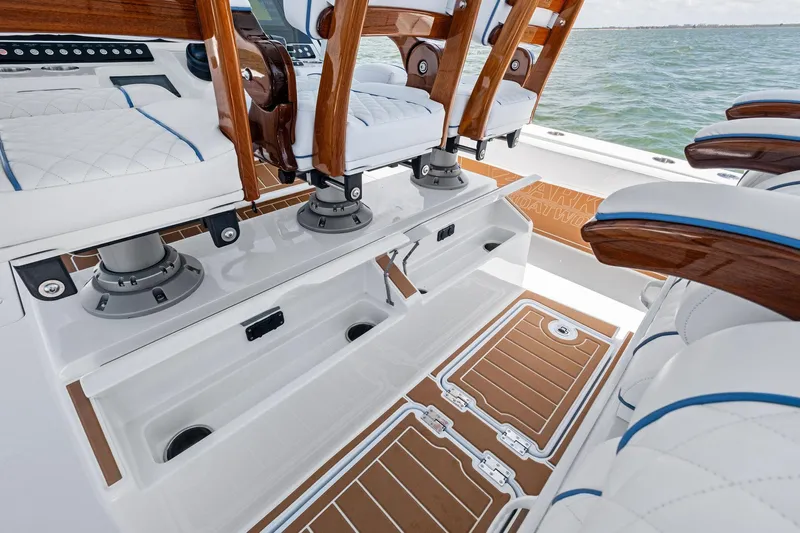 Down Range Yacht Photos Pics 2023 Barker Boatworks 40 HPC interior with luxurious seating and storage compartments.