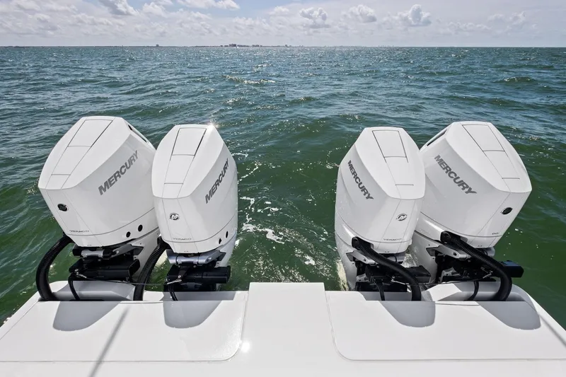 Down Range Yacht Photos Pics 2023 Barker Boatworks 40 HPC with four Mercury outboard engines on open water.