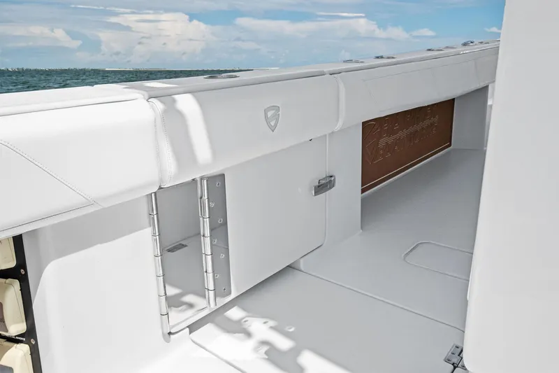 Down Range Yacht Photos Pics 2023 Barker Boatworks 40 HPC interior with sleek white design and ocean view.