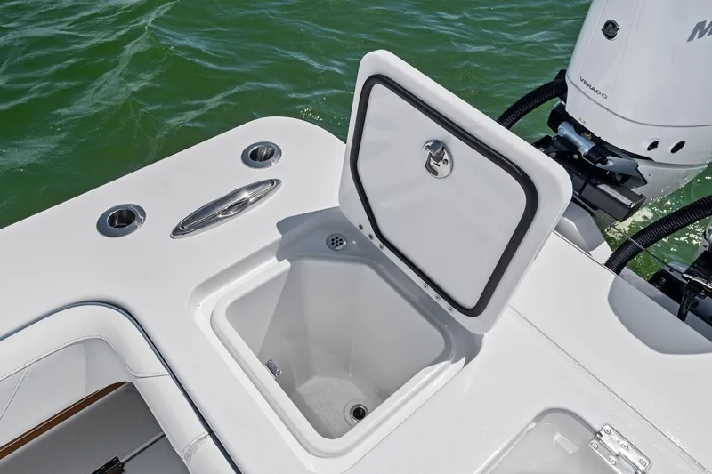 Down Range Yacht Photos Pics 2023 Barker Boatworks 40 HPC with open storage compartment on deck, near outboard motor.