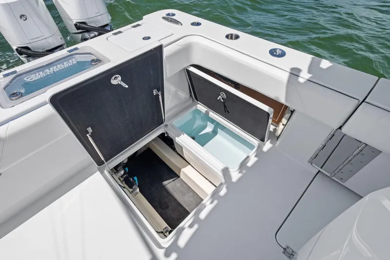 Down Range Yacht Photos Pics 2023 Barker Boatworks 40 HPC deck with open storage compartments and outboard motors.