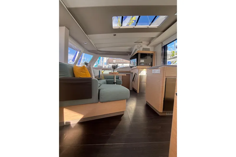 The Ilusion Yacht Photos Pics Luxurious interior of 2025 Fountaine Pajot 41 catamaran with modern furnishings and ample natural light.