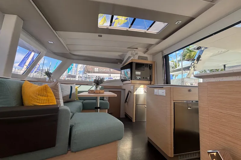The Ilusion Yacht Photos Pics Luxurious interior of 2025 Fountaine Pajot 41 catamaran with modern furnishings and ample natural light.