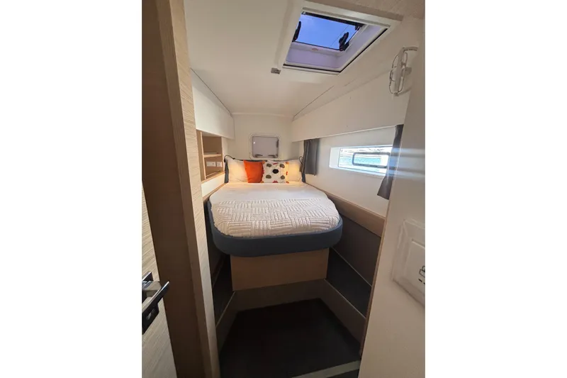 The Ilusion Yacht Photos Pics 2025 Fountaine Pajot 41 yacht cabin with cozy bed and skylight.
