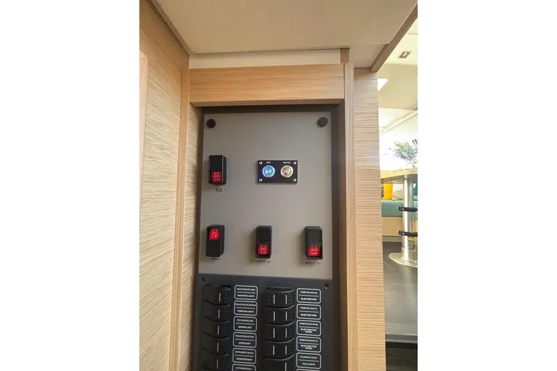 The Ilusion Yacht Photos Pics Control panel inside 2025 Fountaine Pajot 41 yacht, featuring switches and labels.