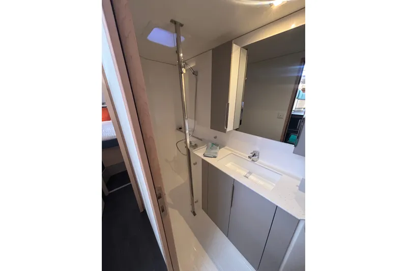 The Ilusion Yacht Photos Pics Modern bathroom in 2025 Fountaine Pajot 41 yacht with sleek fixtures and ample storage.