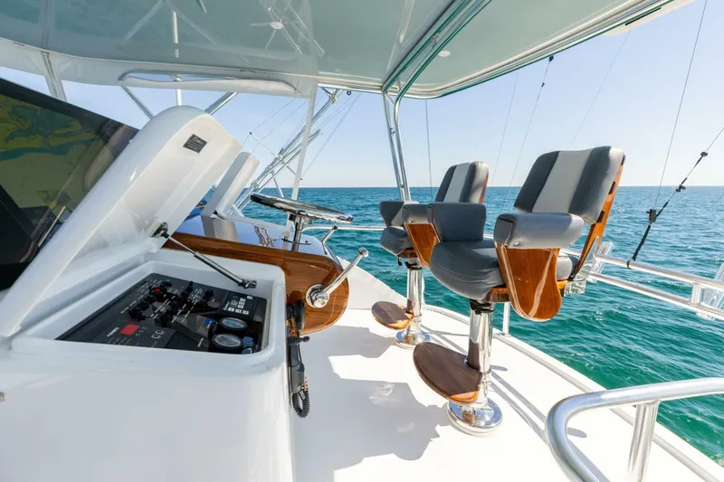  Yacht Photos Pics Helm of 2012 Hatteras 60 GT yacht with dual captain chairs and ocean view.