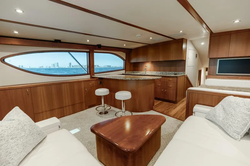  Yacht Photos Pics Luxurious interior of 2012 Hatteras 60 GT yacht with modern furnishings and ocean view.
