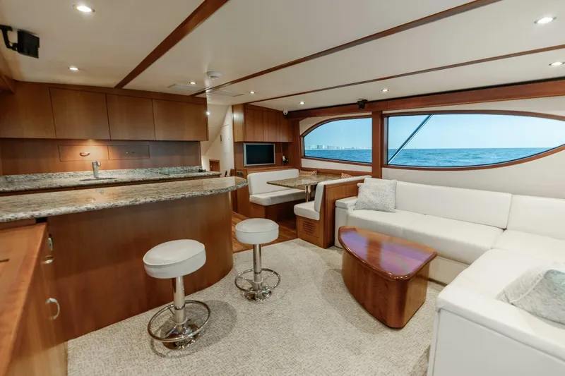  Yacht Photos Pics Luxurious interior of 2012 Hatteras 60 GT yacht with modern kitchen and ocean view.