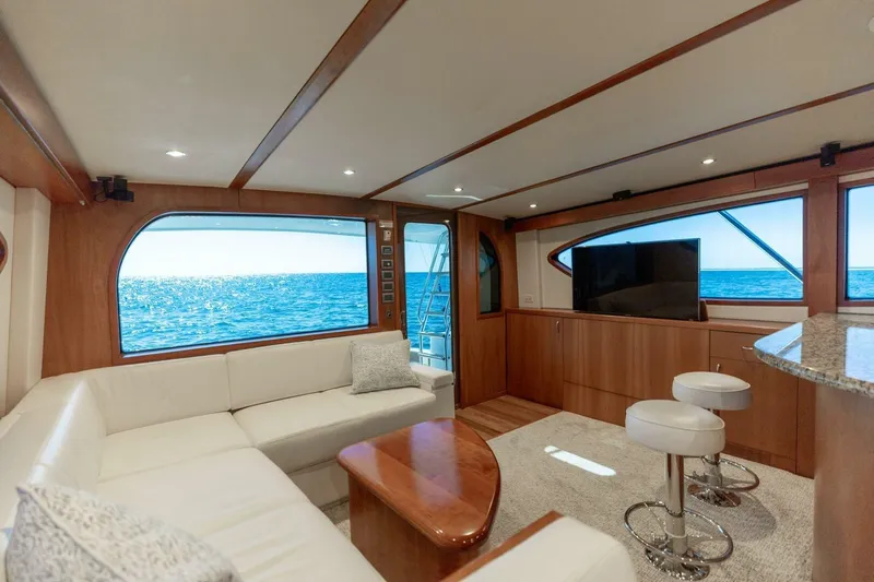  Yacht Photos Pics Luxurious interior of 2012 Hatteras 60 GT yacht with ocean view windows.