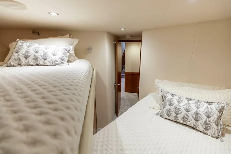  Yacht Photos Pics Interior of 2012 Hatteras 60 GT yacht with cozy twin beds and elegant decor.