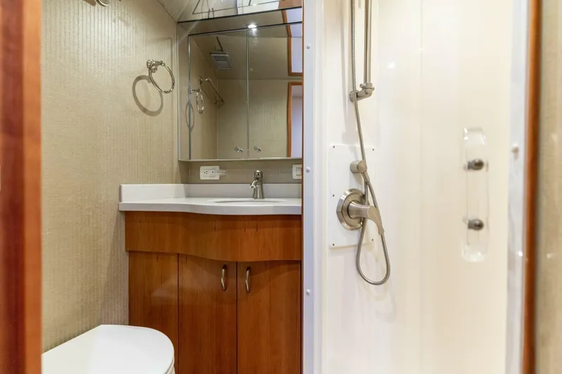  Yacht Photos Pics Bathroom interior of 2012 Hatteras 60 GT yacht with shower and vanity.