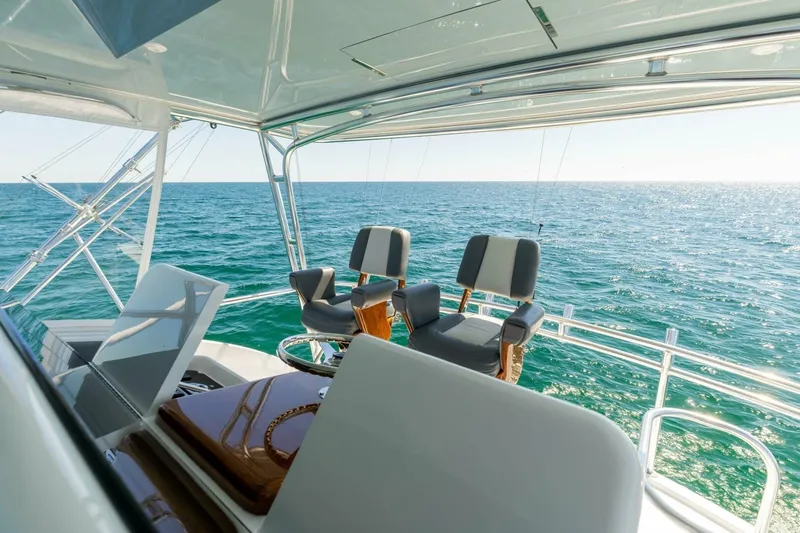  Yacht Photos Pics Flybridge view of 2012 Hatteras 60 GT yacht overlooking the ocean.