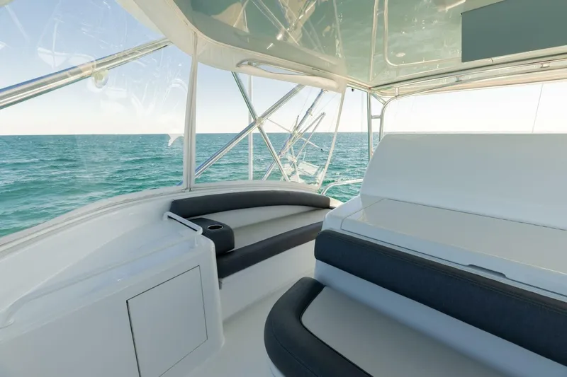  Yacht Photos Pics Interior view of 2012 Hatteras 60 GT yacht with ocean backdrop.