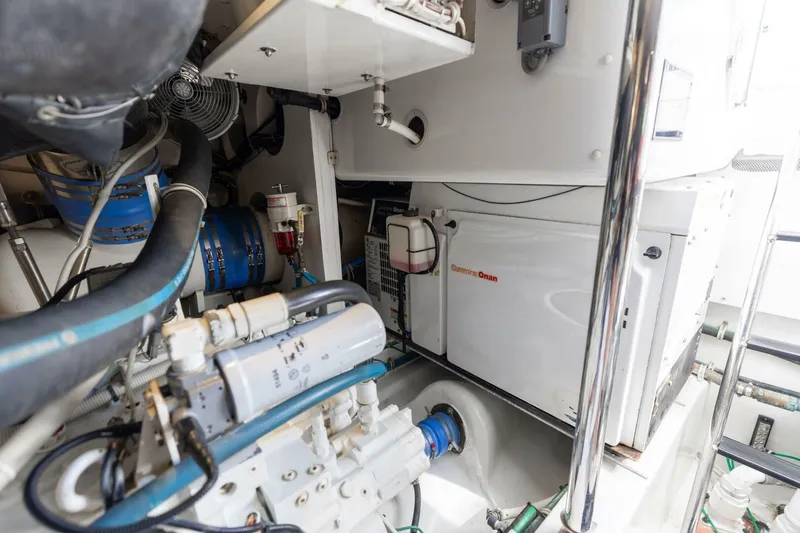  Yacht Photos Pics Engine room of 2012 Hatteras 60 GT yacht with Cummins Onan generator.