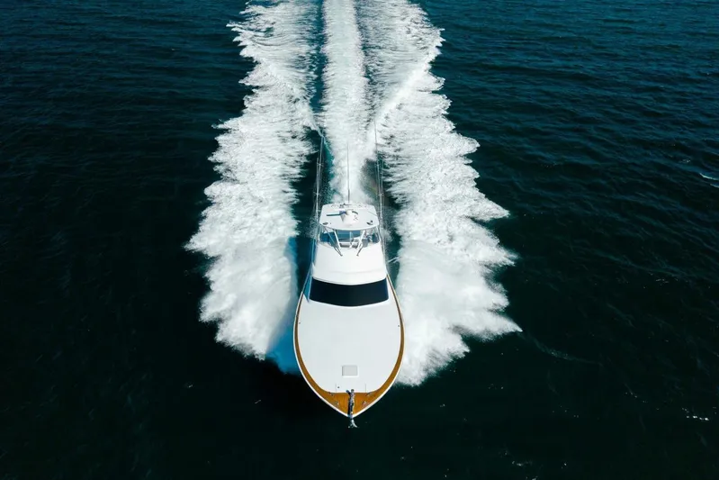  Yacht Photos Pics Aerial view of 2012 Hatteras 60 GT yacht cruising on open water.