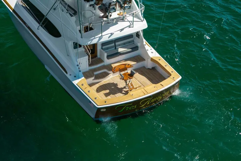  Yacht Photos Pics Aerial view of 2012 Hatteras 60 GT yacht on clear blue water.