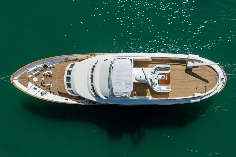 Lady Dina Yacht Photos Pics Overhead view of 1989 Moonen 85 Long Range Cruiser yacht on green water.