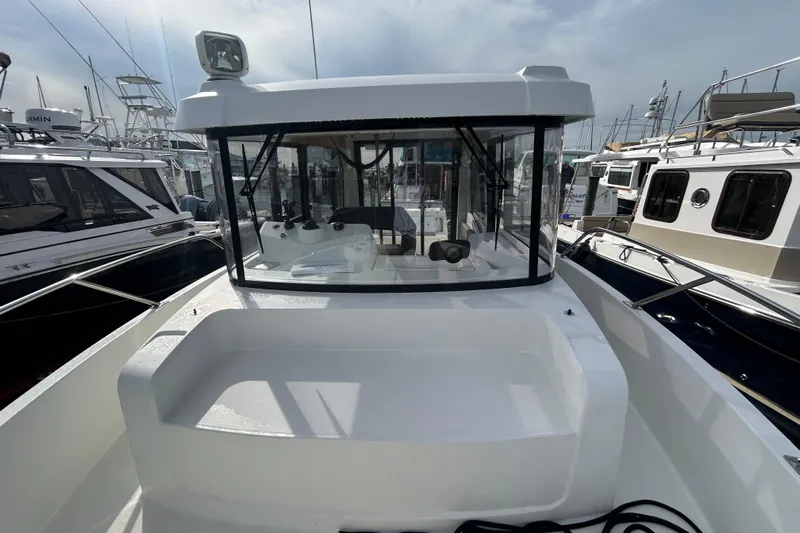  Yacht Photos Pics 2020 Beneteau Barracuda 9 boat docked, showcasing cockpit and helm station.