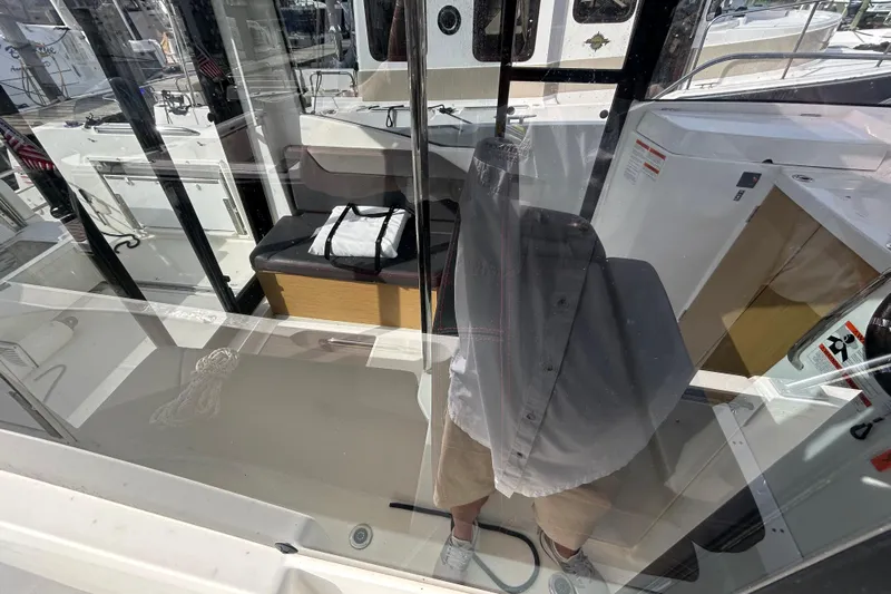  Yacht Photos Pics Interior view of 2020 Beneteau Barracuda 9 boat, featuring seating and storage.