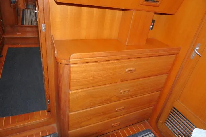Sun Bird Yacht Photos Pics Wooden interior of 2002 Tayana 460 Vancouver Pilothouse with drawers and door.