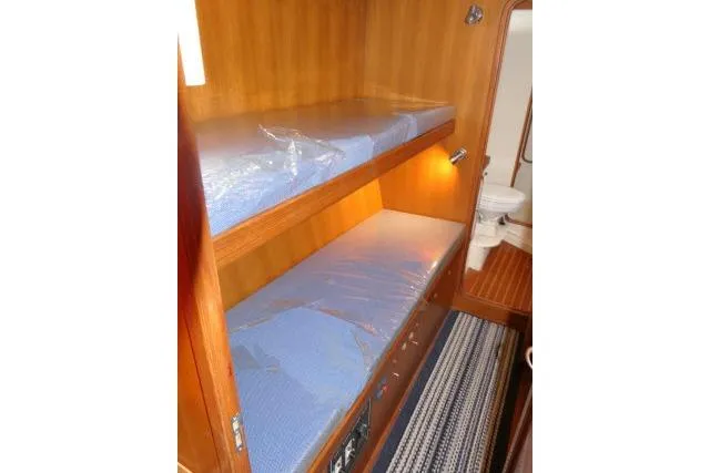 Sun Bird Yacht Photos Pics Bunk beds in 2002 Tayana 460 Vancouver Pilothouse with adjacent bathroom.