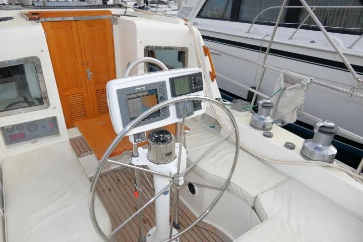 Sun Bird Yacht Photos Pics Pilothouse of 2002 Tayana 460 Vancouver, featuring navigation equipment and steering wheel.