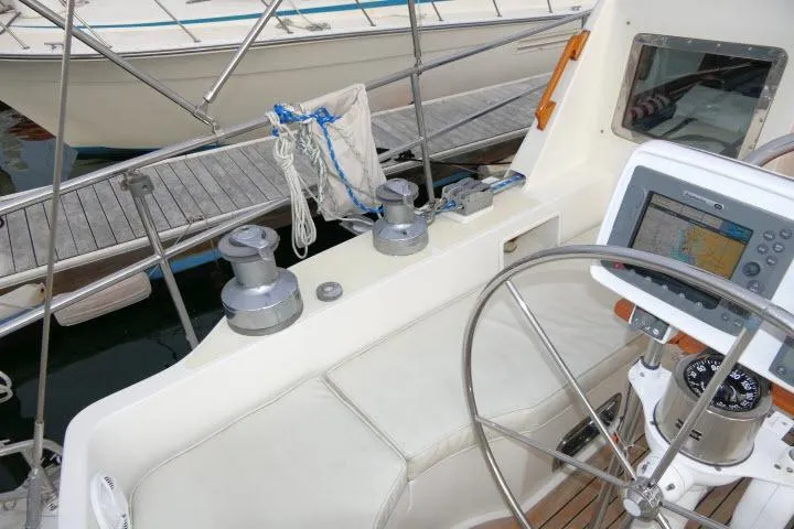 Sun Bird Yacht Photos Pics 2002 Tayana 460 Vancouver Pilothouse cockpit with navigation equipment and steering wheel.