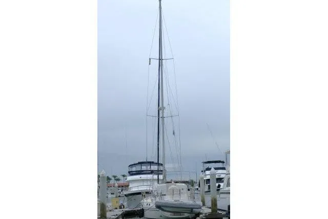 Sun Bird Yacht Photos Pics 2002 Tayana 460 Vancouver Pilothouse sailboat docked at a marina under cloudy skies.