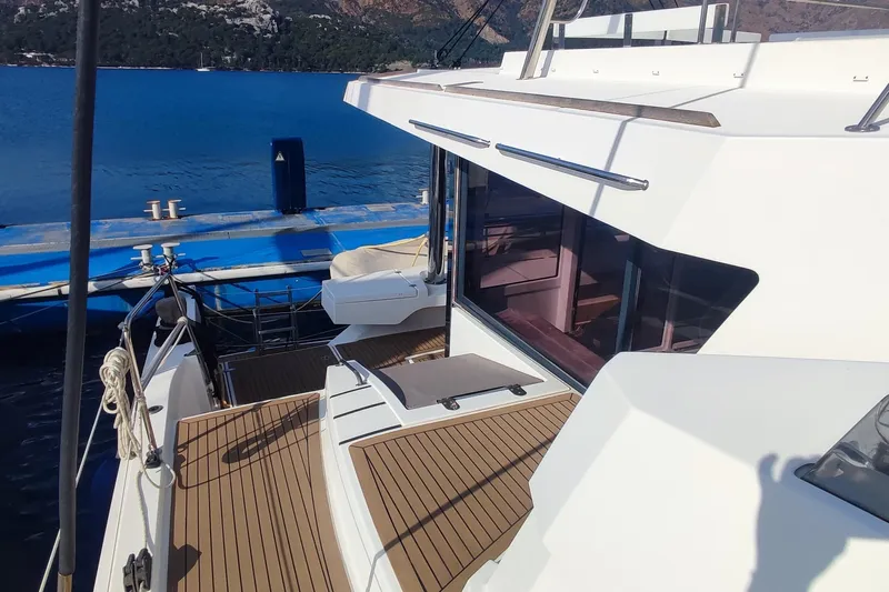 Helios Yacht Photos Pics 2021 Bali 5.4 yacht docked, featuring sleek design and spacious deck.