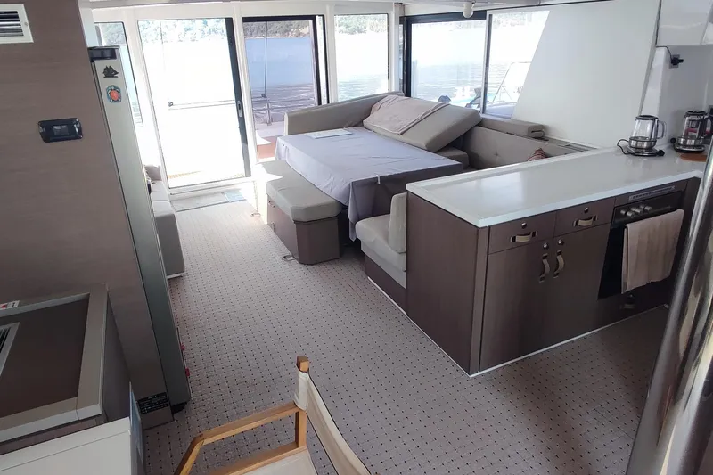 Helios Yacht Photos Pics Modern interior of 2021 Bali 5.4 yacht with kitchen and seating area.