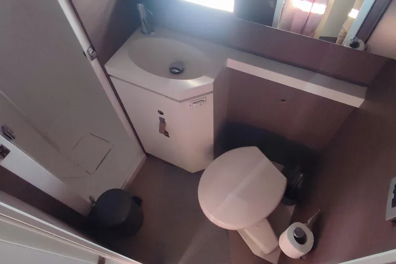 Helios Yacht Photos Pics Compact bathroom in a 2021 Bali 5.4 model, featuring a sink and toilet.