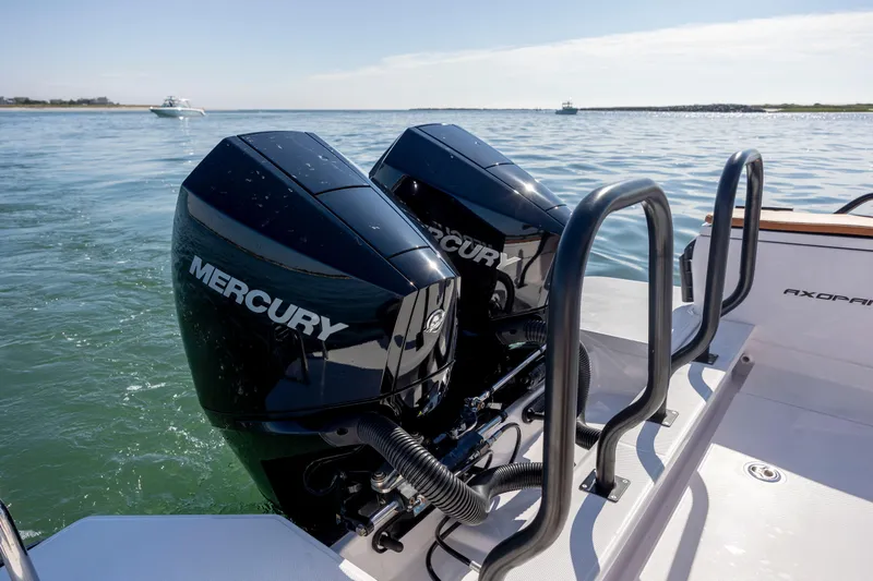  Yacht Photos Pics 2024 Axopar 28 CABIN with dual Mercury outboard engines on calm water.