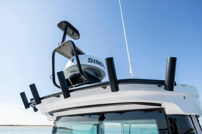  Yacht Photos Pics 2024 Axopar 28 CABIN boat roof with radar and rod holders.