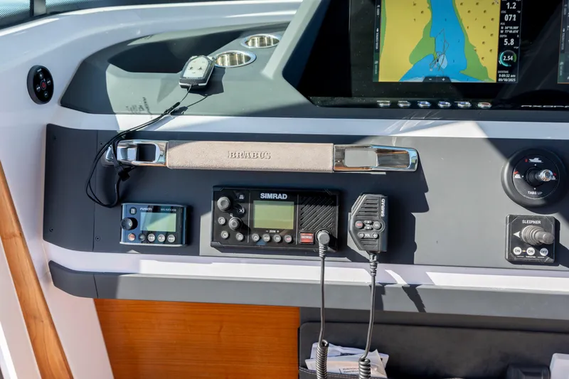  Yacht Photos Pics 2024 Axopar 28 CABIN dashboard with navigation and communication equipment.