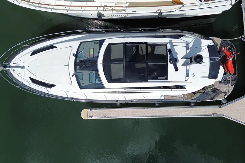  Yacht Photos Pics Overhead view of a 2009 Marquis 500 Sport Coupe yacht docked at a marina.