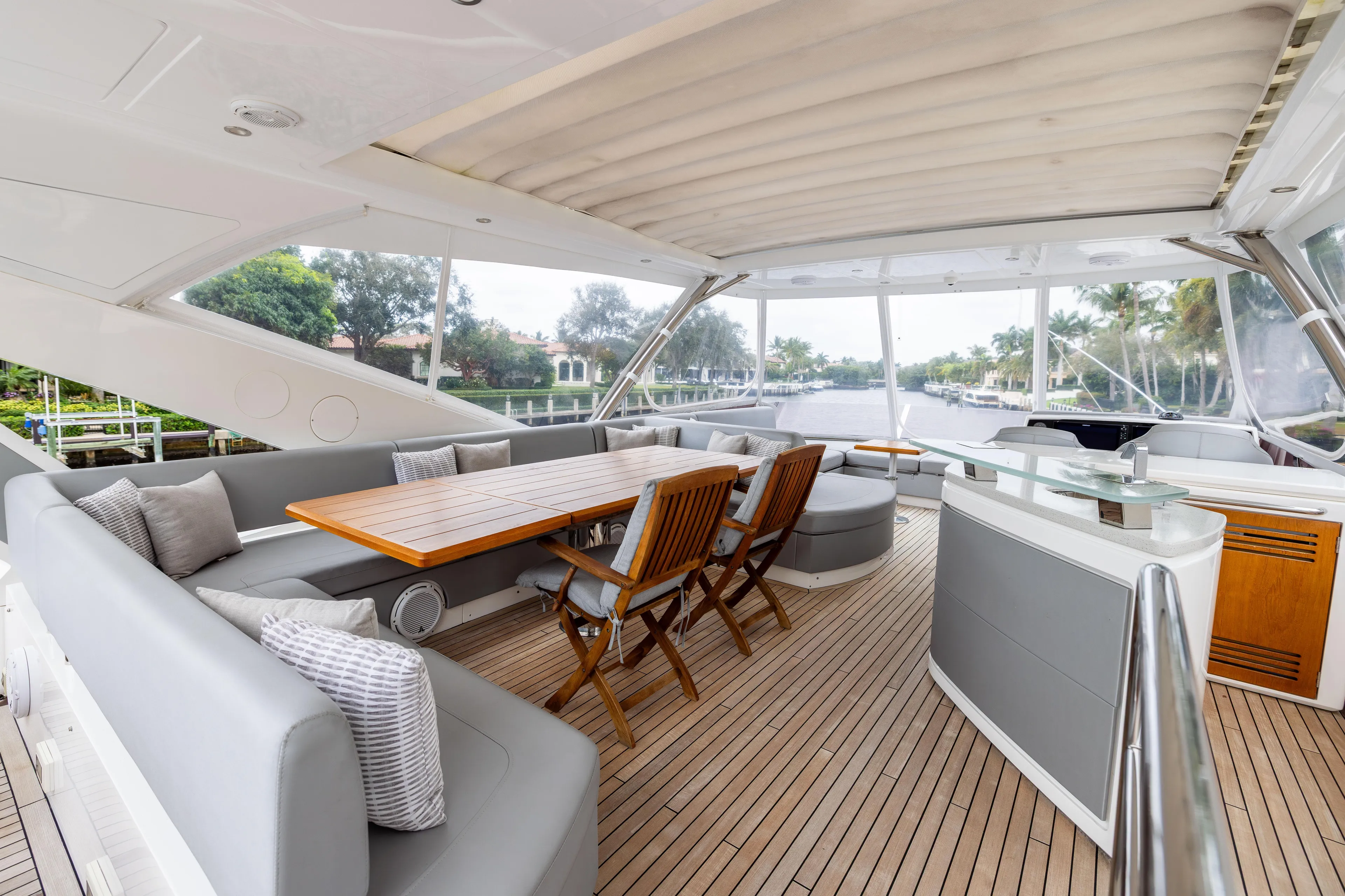 Journey Yacht Photos Pics Luxurious Sunseeker 76 yacht interior, featuring elegant seating and dining area, 2019 model.
