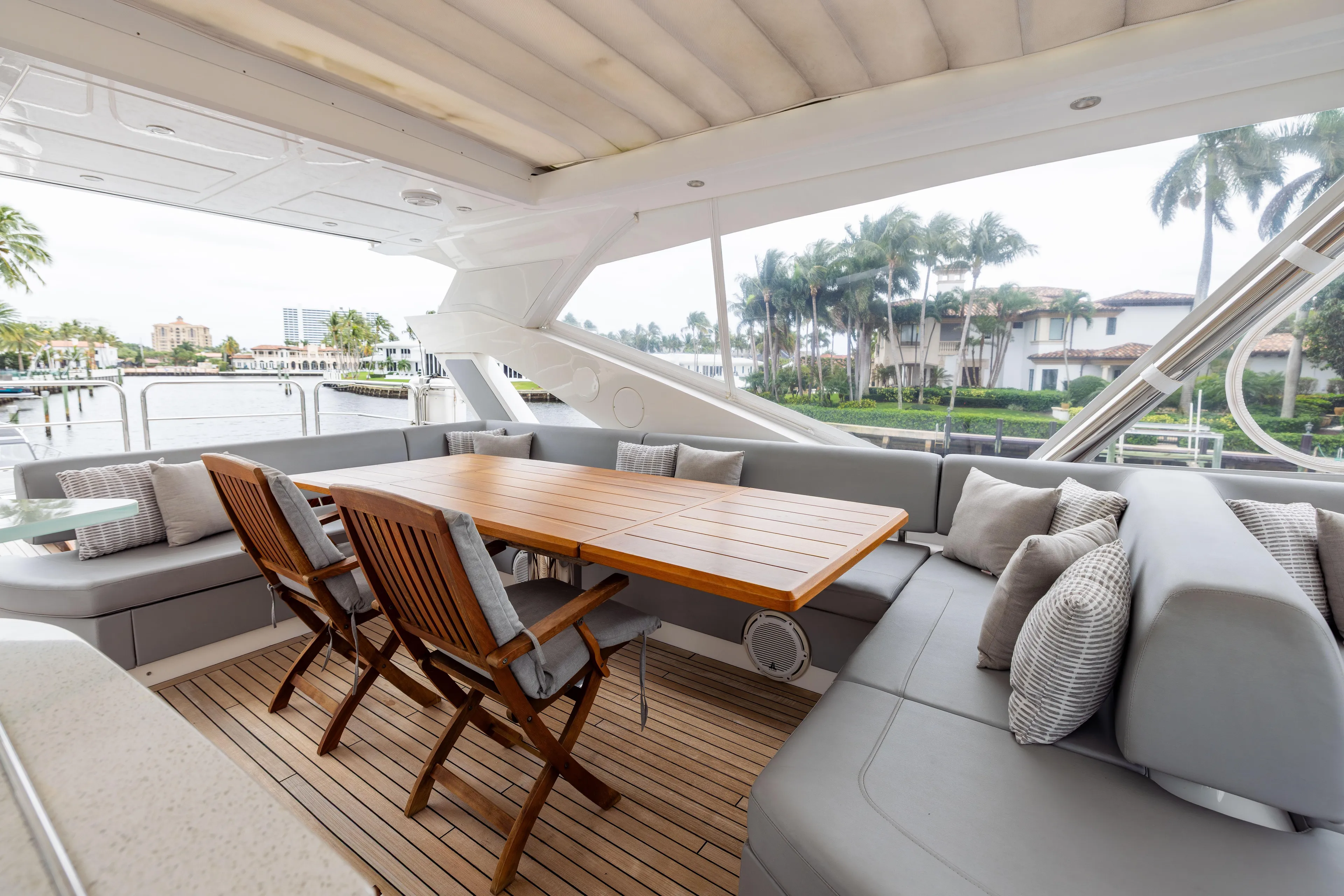 Journey Yacht Photos Pics Luxurious Sunseeker 76 yacht deck with elegant seating and dining area, 2019 model.